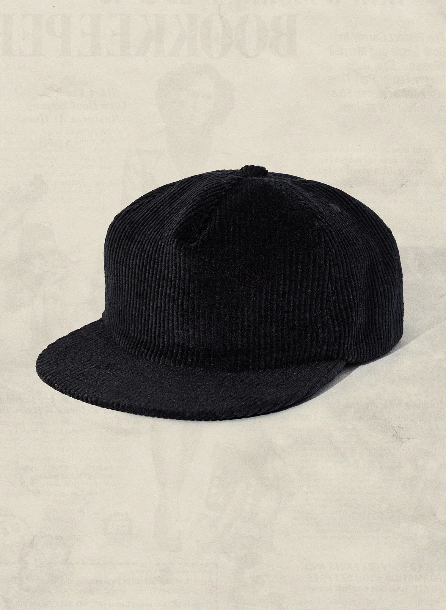 Black corduroy cap from Qu!rk Boutique, modern style, sustainable fashion accessory