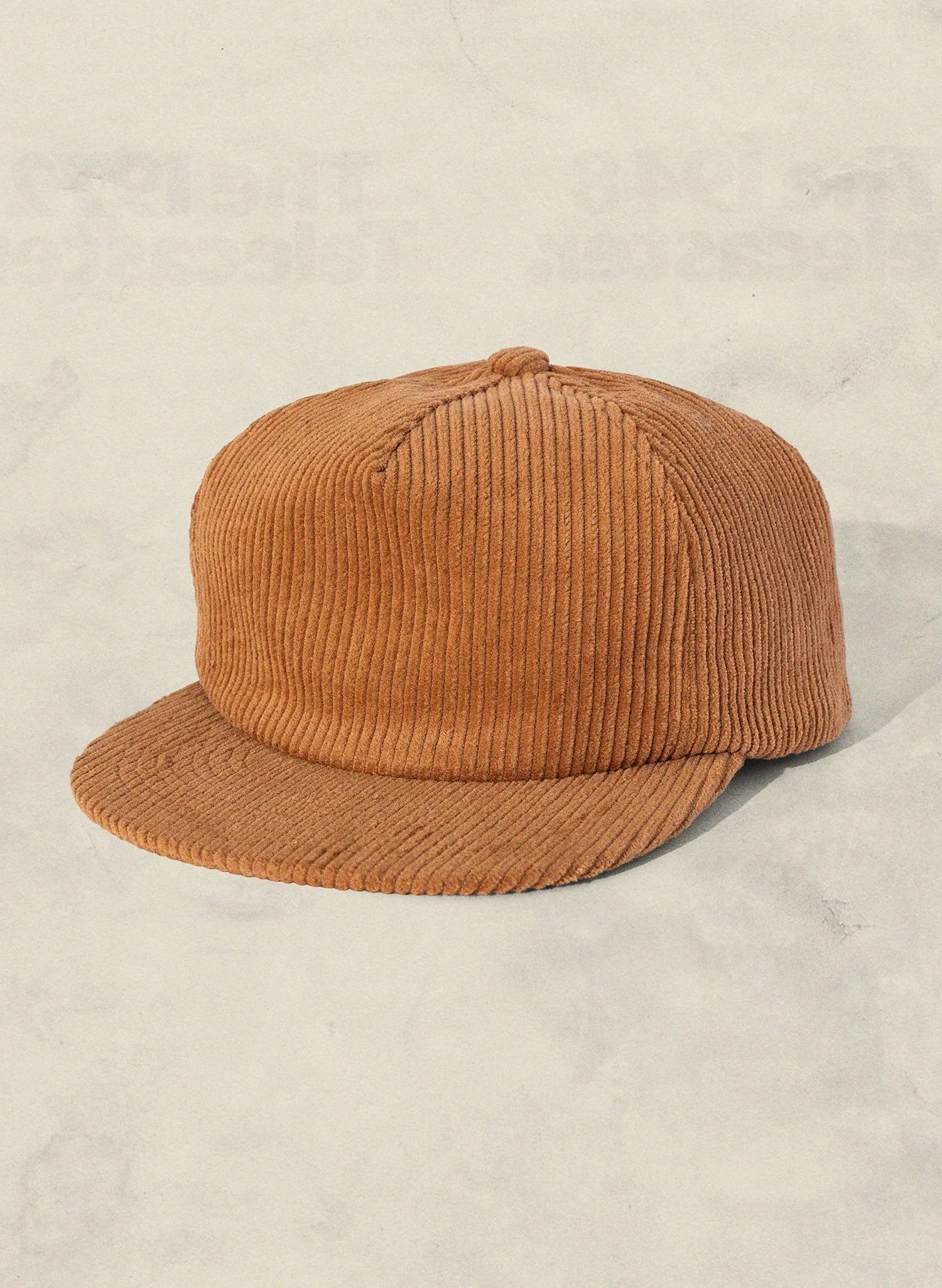 Tan corduroy baseball cap on a light textured background, Qu!rk Boutique accessory
