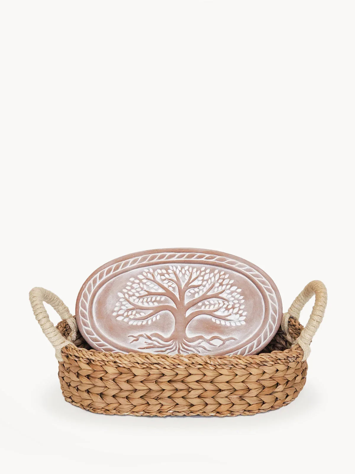 Oval ceramic bread warmer with white tree of life design in woven basket with rope handles