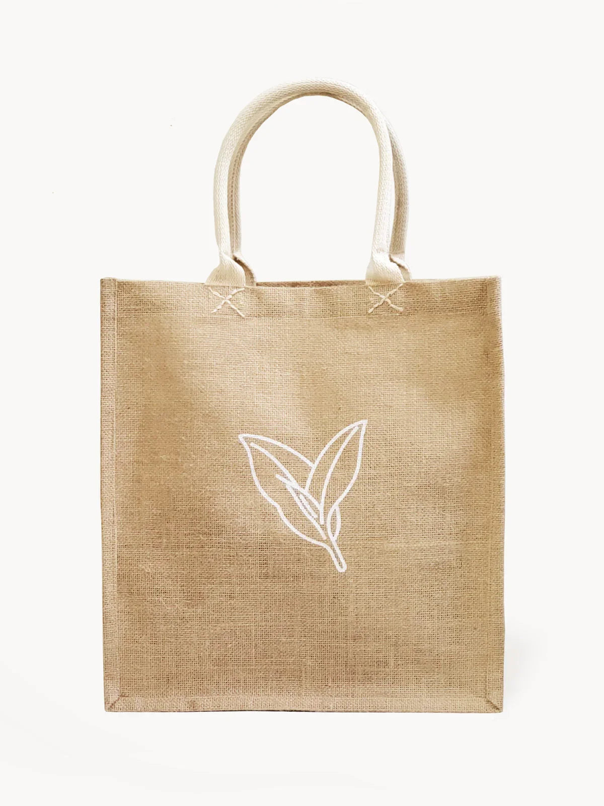 Natural jute grocery tote bag with white leaf design and sturdy handles