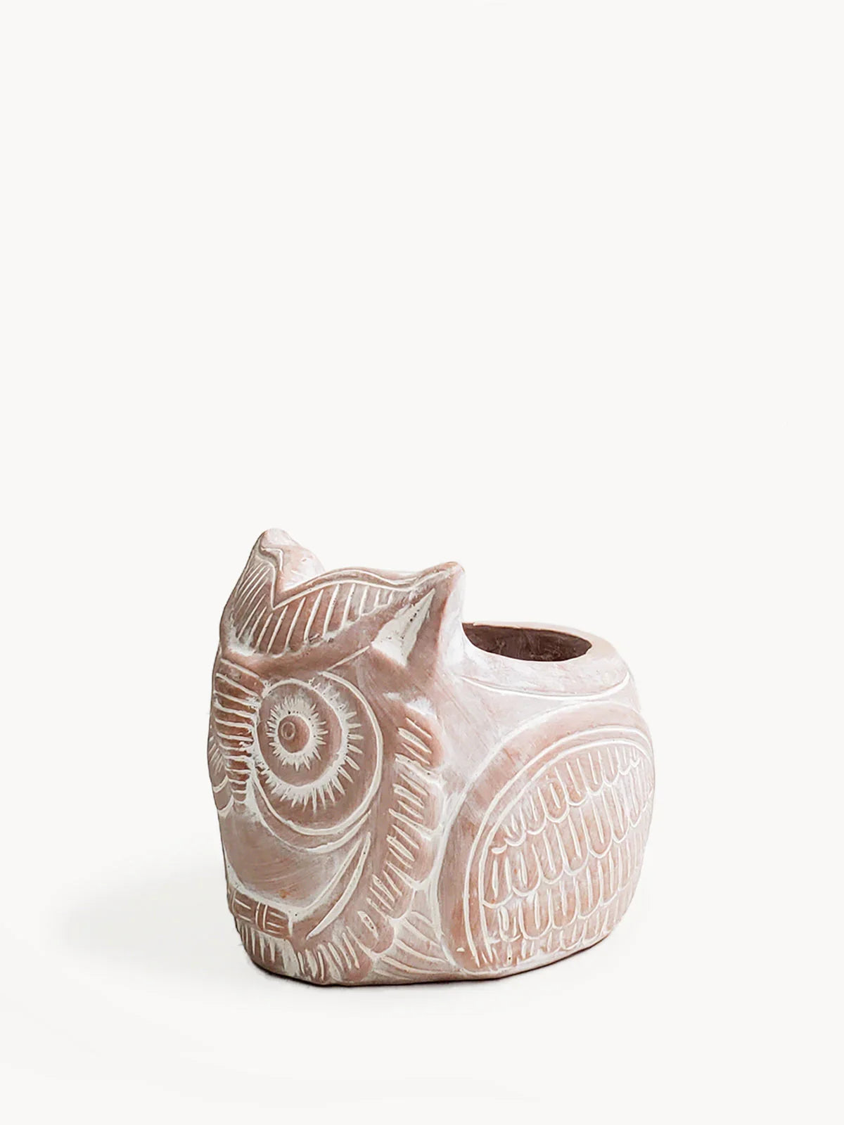 Terracotta planter shaped like a carved horned owl with detailed feather patterns on white background