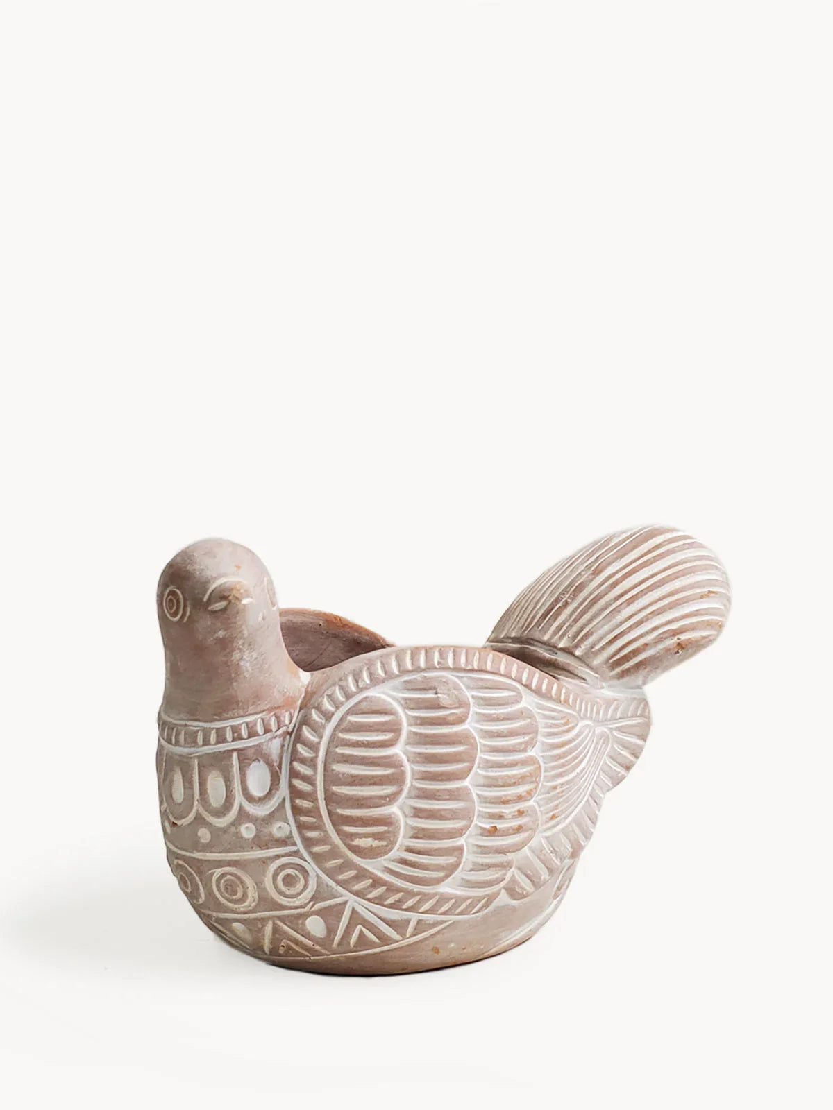 Terracotta planter shaped like a dove with detailed carved wing and body patterns