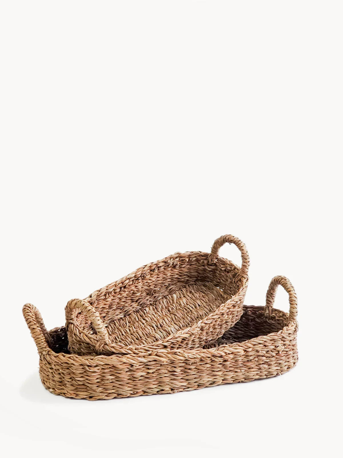 Set of 2 handcrafted natural woven bread baskets with handles on white background