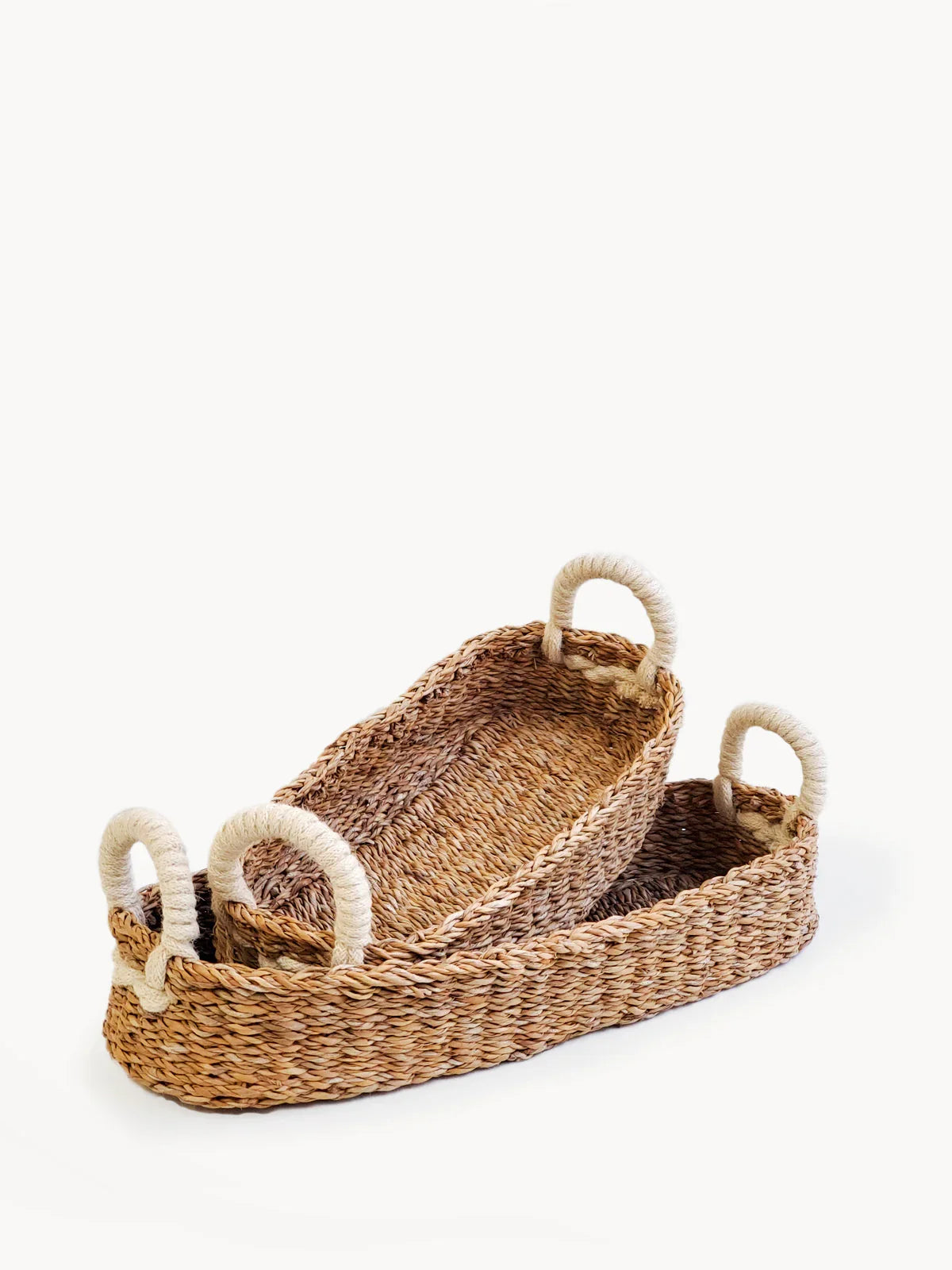Set of 2 woven bread baskets with white rope handles on a white background