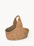 Handwoven seagrass picnic basket with curved handle, eco-friendly from Qu!rk Boutique