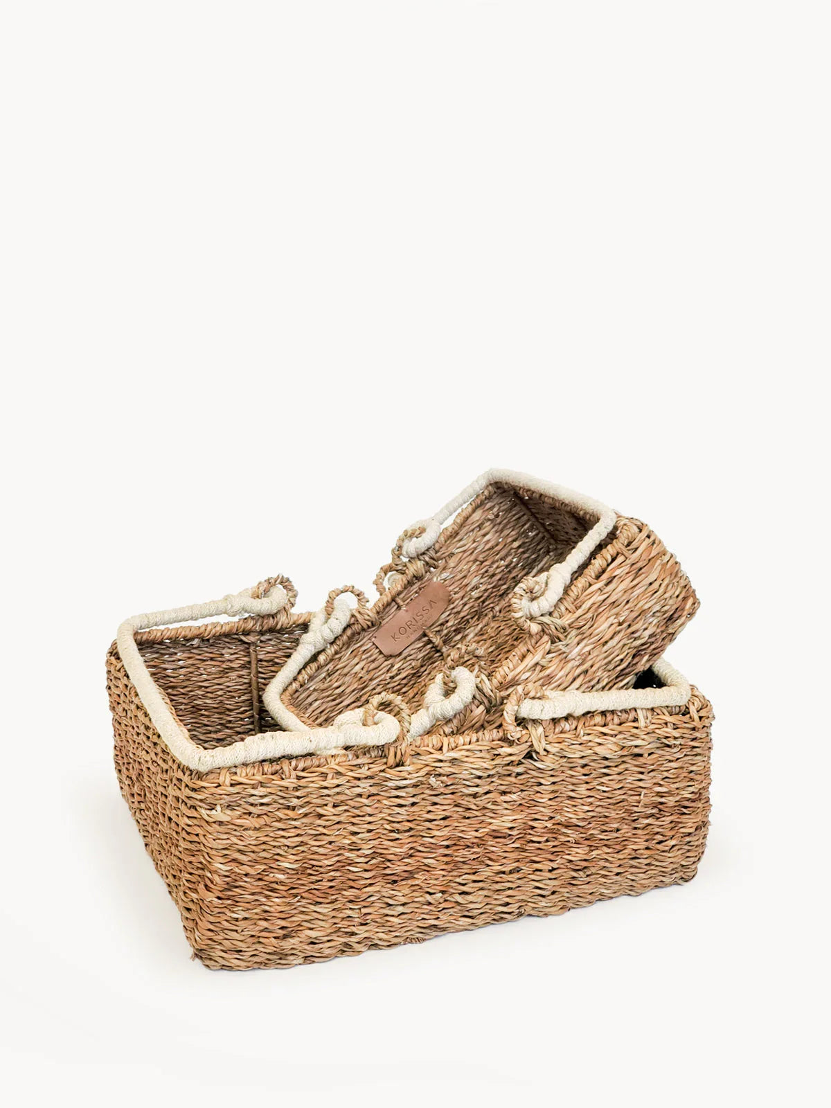 Natural woven storage baskets with rope handles, eco-friendly, at Qu!rk Boutique