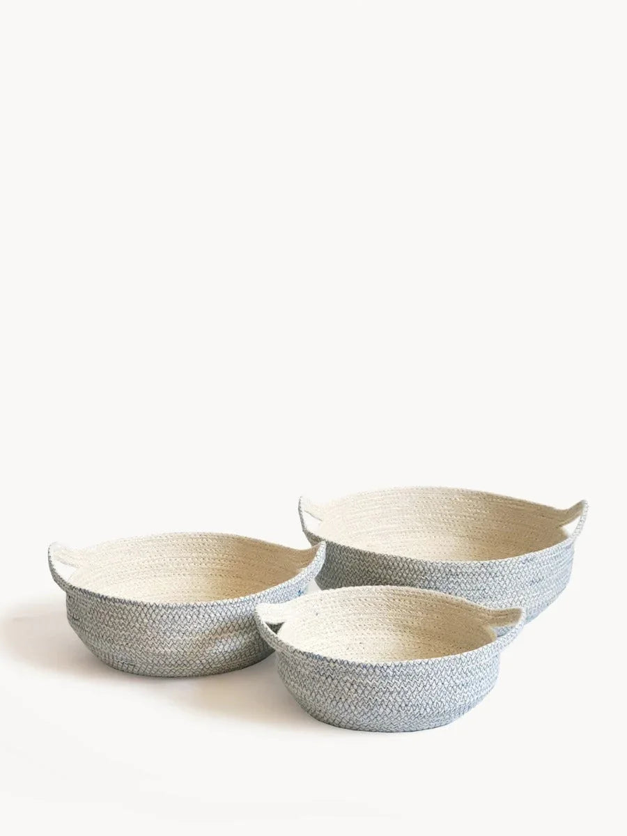 Set of three blue and white woven baskets with handles, styled for Qu!rk Boutique home decor