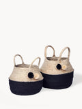 Set of two black and natural woven baskets with handles and pom pom accents, Qu!rk Boutique