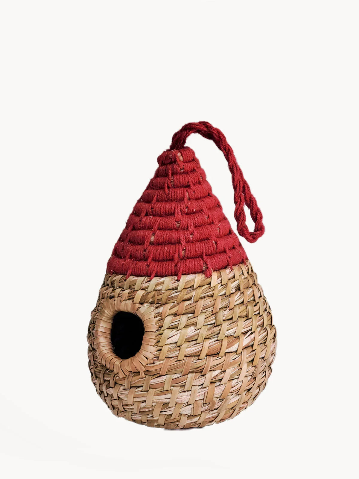 Handwoven teardrop birdhouse with natural straw body and red rope top, hanging loop