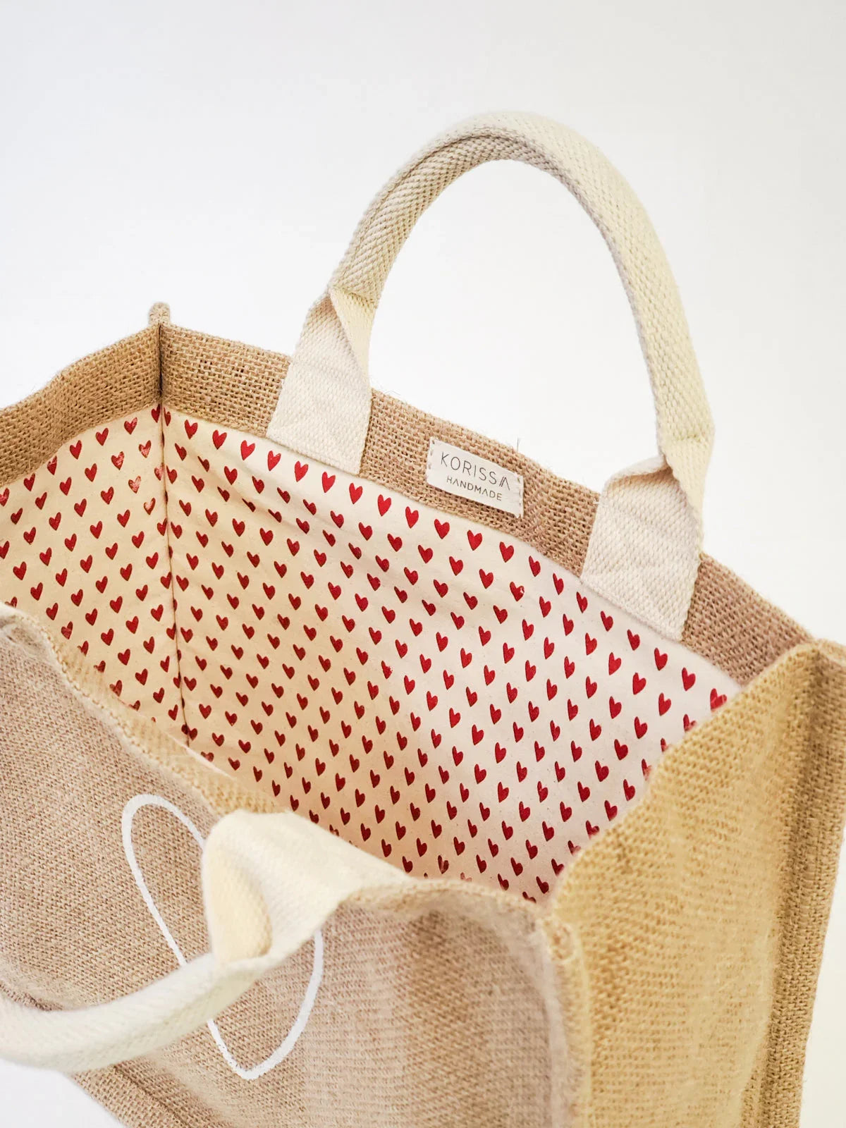 Eco-friendly jute tote bag with heart-print cotton lining, from Qu!rk Boutique gift shop