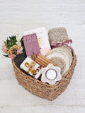 Woven basket gift set with dried flowers, Palo Santo, soap, coasters, candle, and knitted cloth