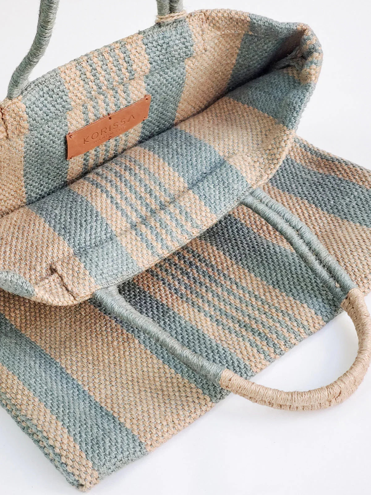 Eco-friendly striped jute tote bag in pale green and beige from Qu!rk Boutique.
