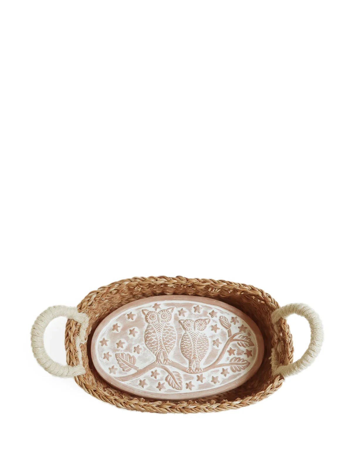 Oval bread warmer basket with rope handles and ceramic lid featuring carved owls on a branch