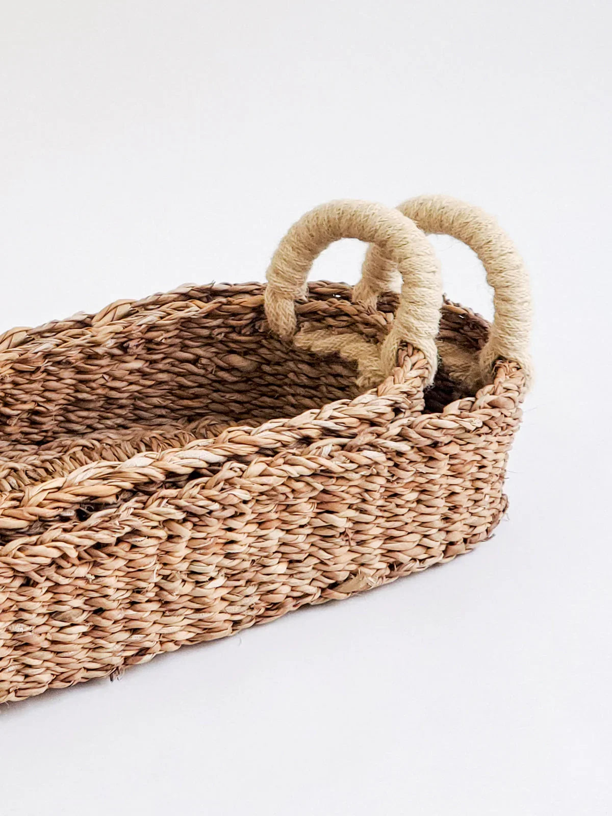 Set of 2 rectangular woven bread baskets with white rope-wrapped handles on white background