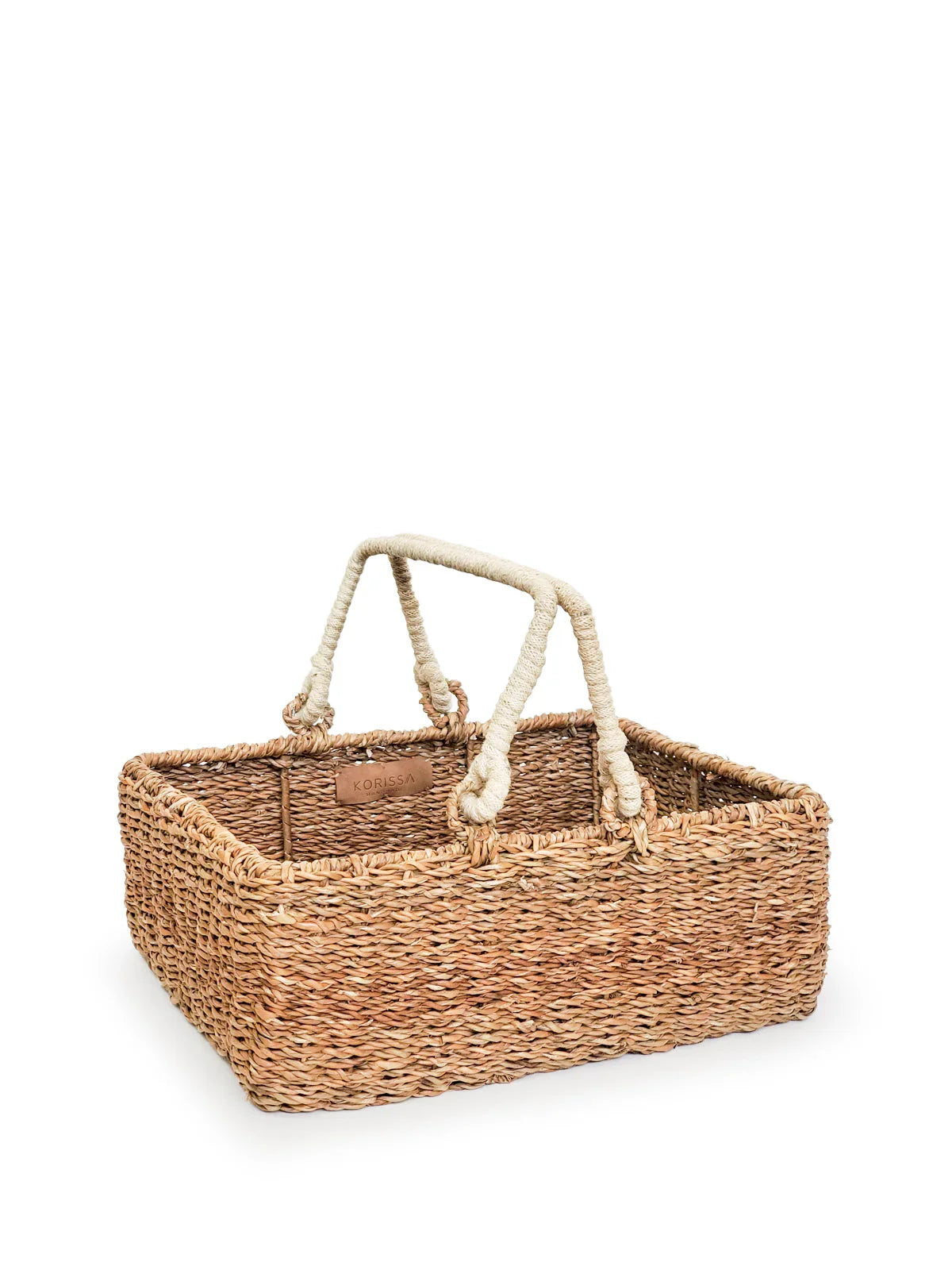 Handwoven rectangular storage basket with rope handles, eco-friendly home decor.