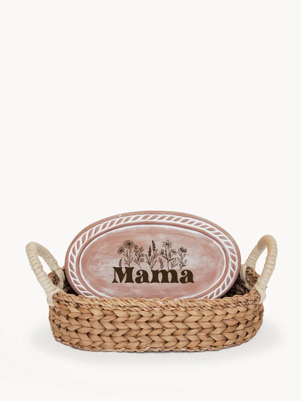 Woven bread warmer basket with handles holding oval ceramic plate decorated with floral design and word Mama
