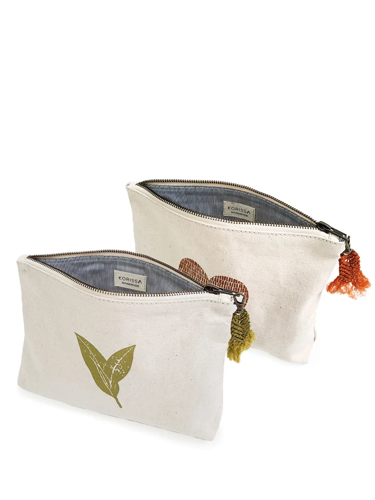 Two handmade canvas pouches with leaf designs and tassel zippers from Qu!rk Boutique