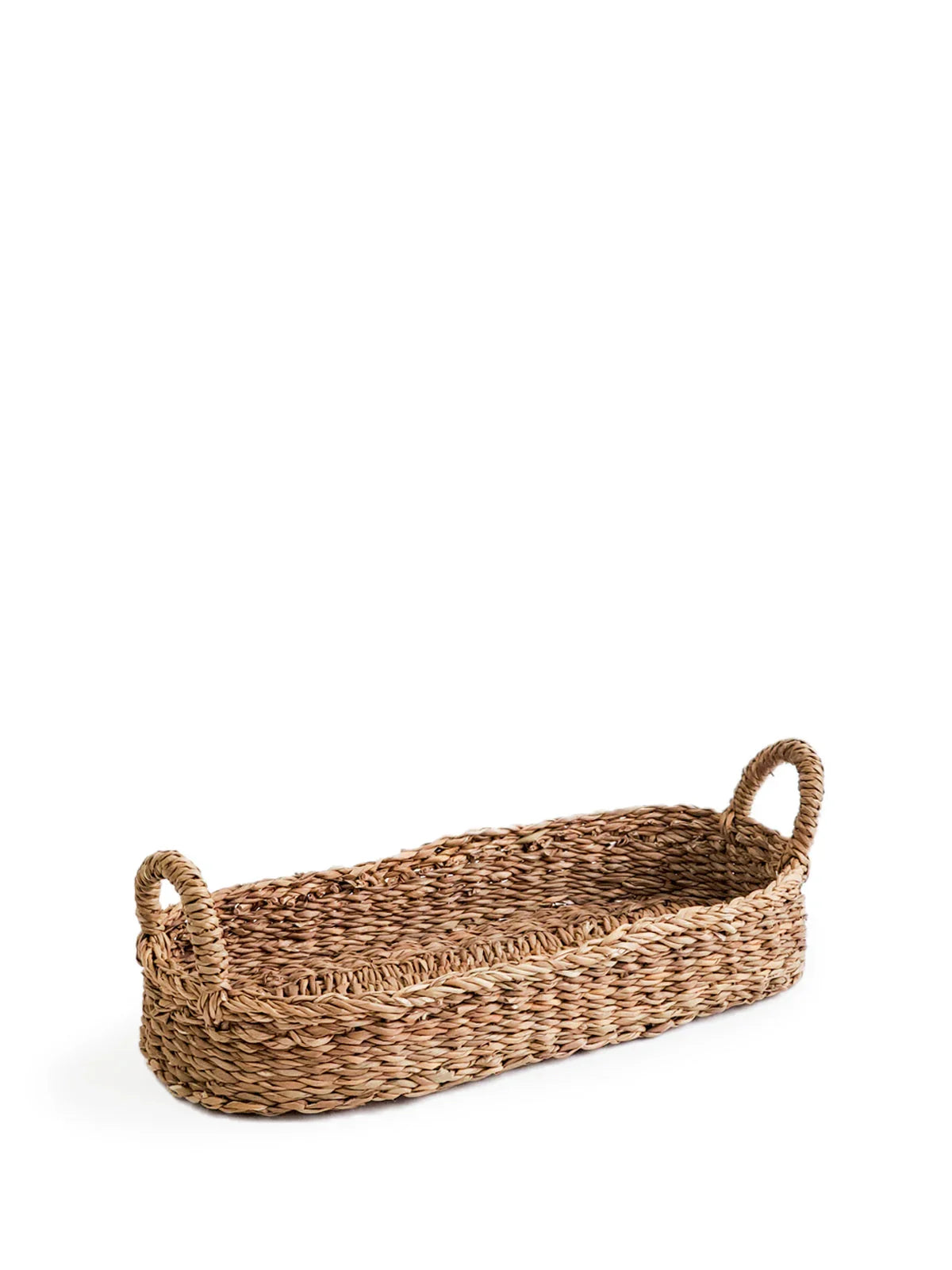 Rectangular woven natural fiber basket with two loop handles on white background