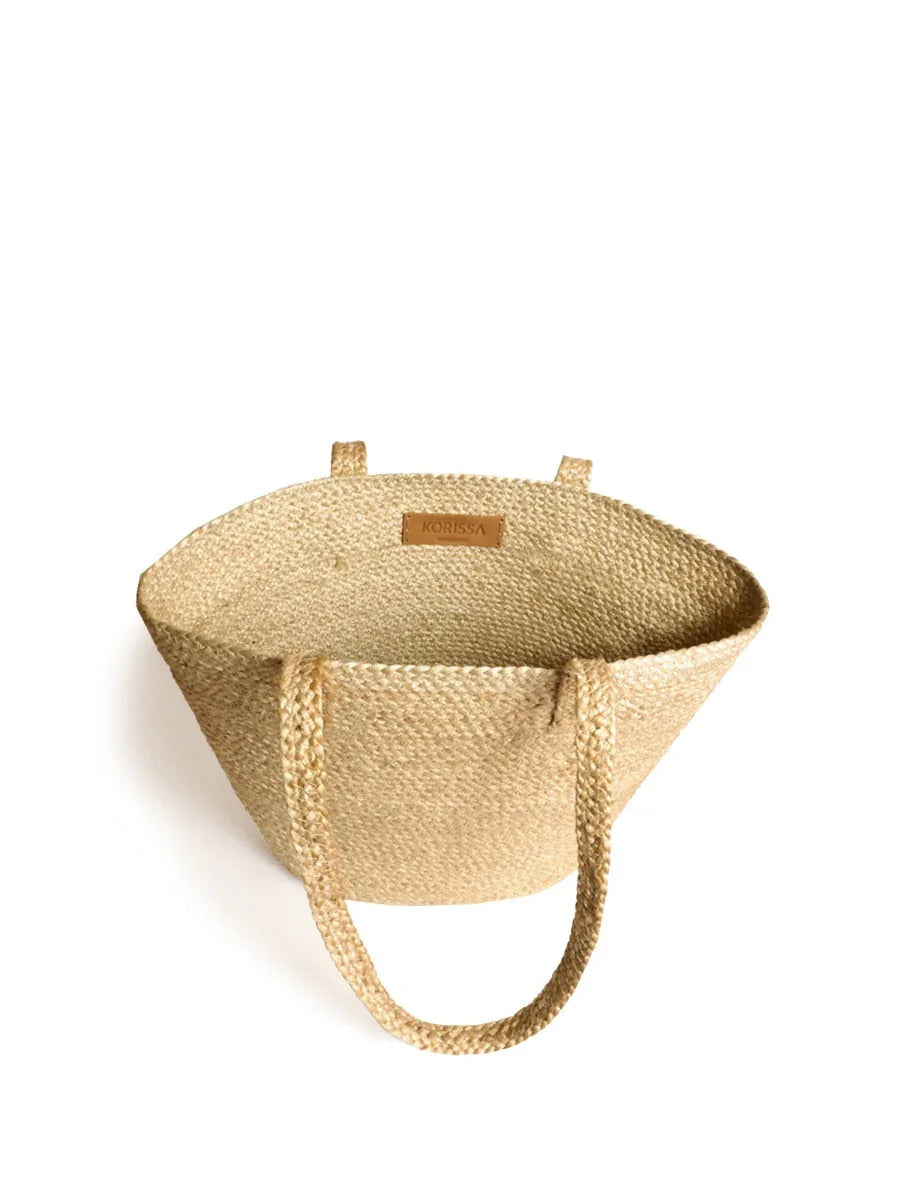 Natural woven shoulder bag with handles, eco-friendly design at Qu!rk Boutique