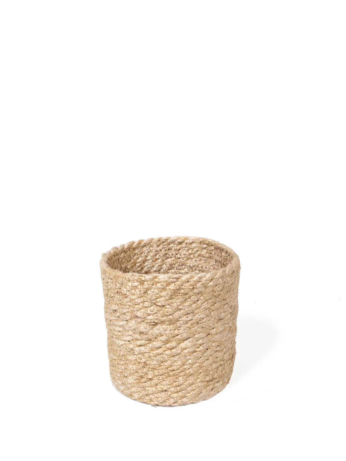 Round natural woven jute storage basket on white background
