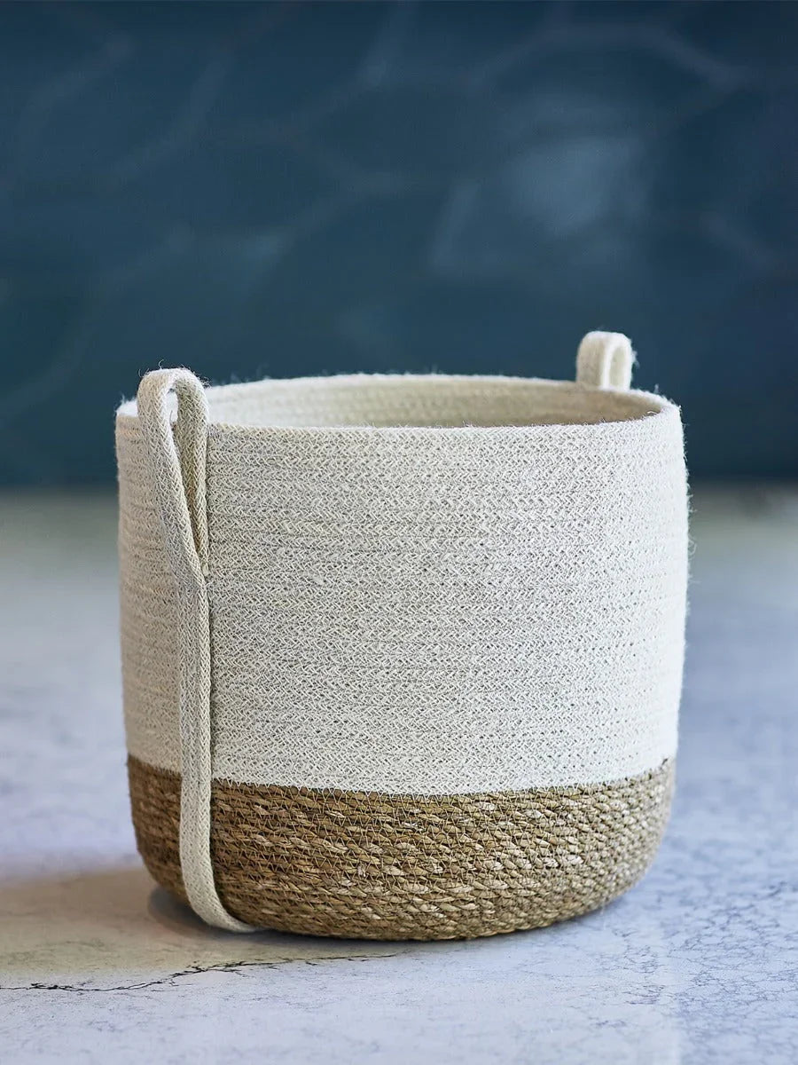 Two-tone woven storage basket with natural jute base and white cotton upper with side handles