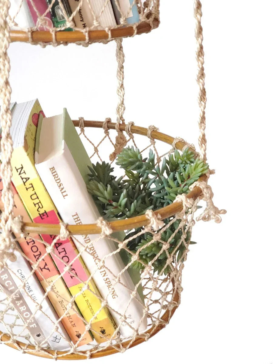 Handmade macramé double hanging shelf with books and green succulent plant