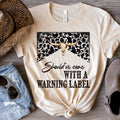 Should've Come With A Warning Label w/ Black Cow Print & Cow Skull - Oatmeal (Tan) Tee