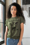 Woman wearing an olive green FAIR TRADE graphic tee, ethically made, at Qu!rk Boutique.