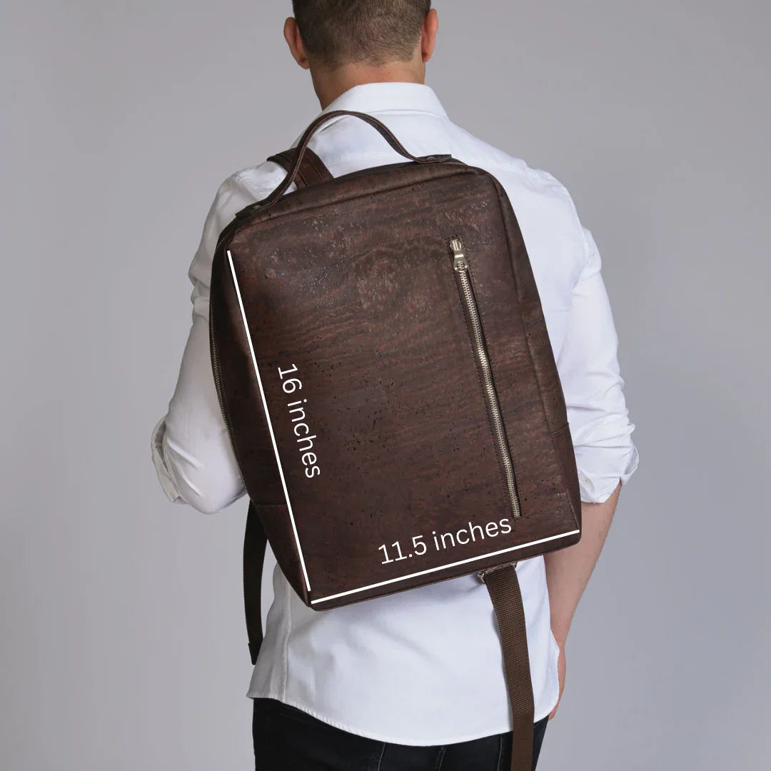 Brown rectangular backpack measuring 16 by 11.5 inches, worn by person in white shirt