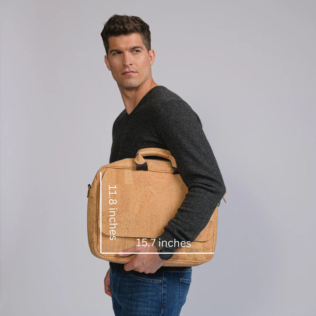 Man holds a cork laptop bag, 11.8 x 15.7 inches, sustainable gift at Qu!rk Boutique.