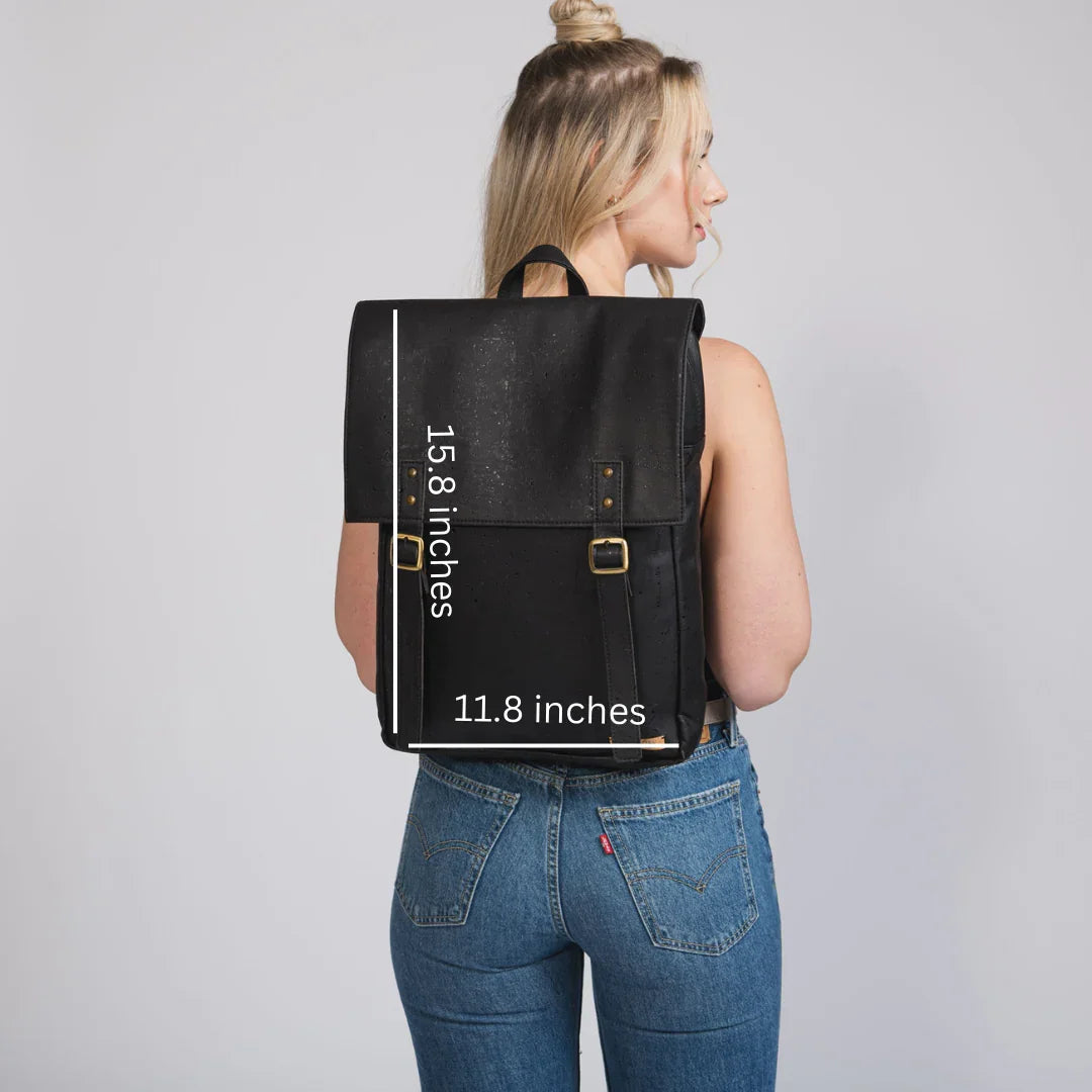 Woman modeling a large black backpack, 15.8 x 11.8 inches, Qu!rk Boutique accessory