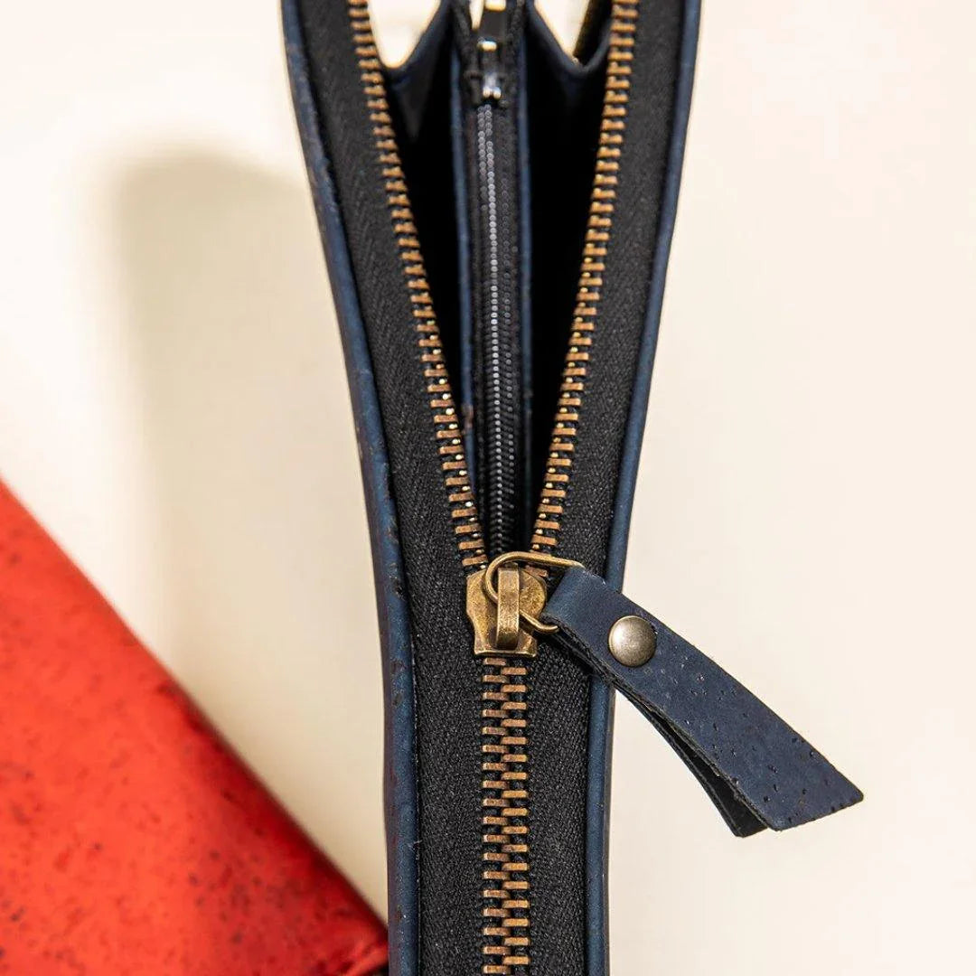 Close-up of blue sustainable zippered pouch with gold zipper, Qu!rk Boutique accessories