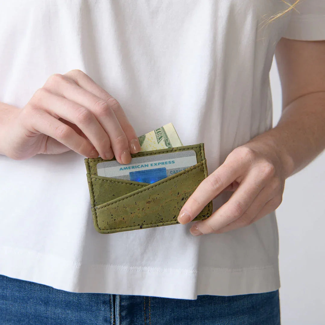 Woman holds olive green sustainable card wallet with cash and credit cards, Qu!rk Boutique