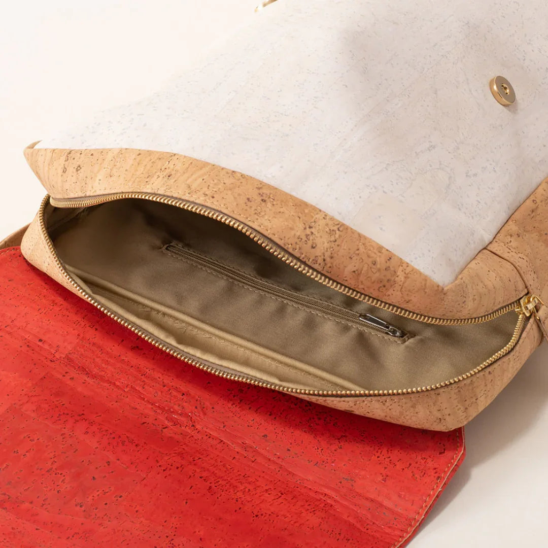 Artist-designed cork clutch bag with a gold zipper and red recycled interior from Qu!rk Boutique