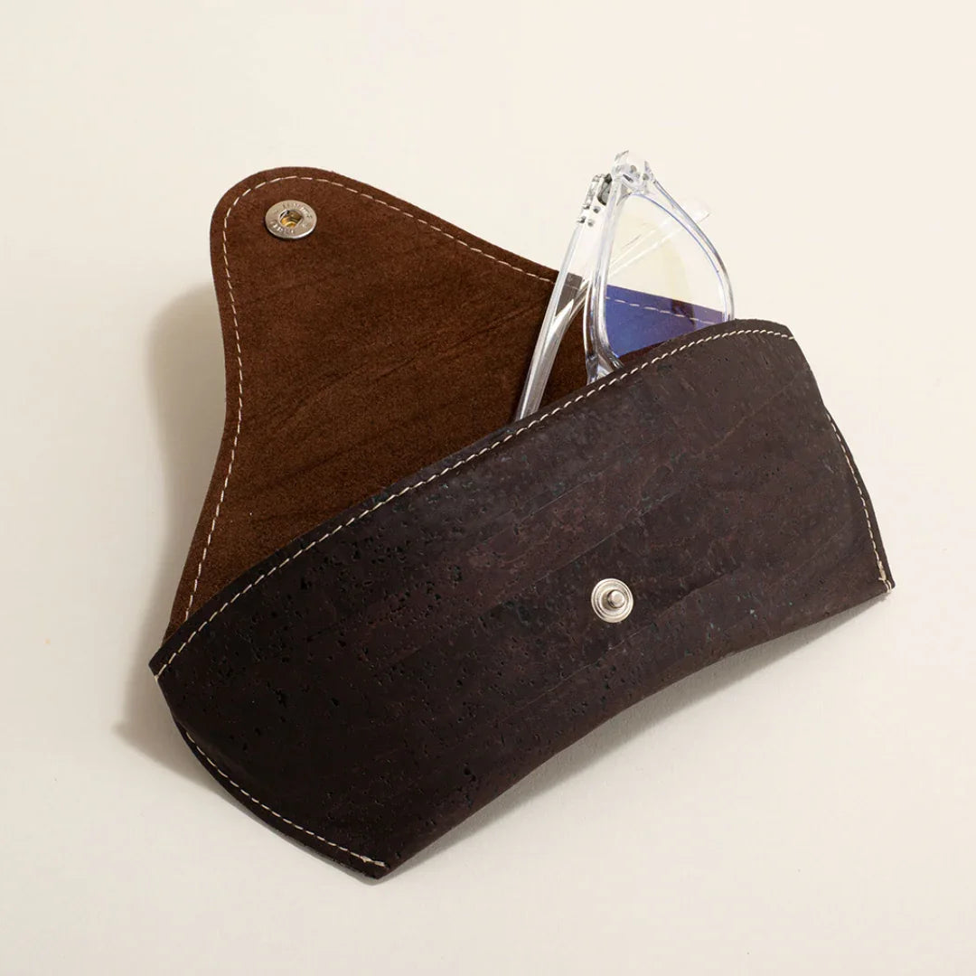 Eco-friendly brown cork eyeglass case with snap closure, holding clear glasses