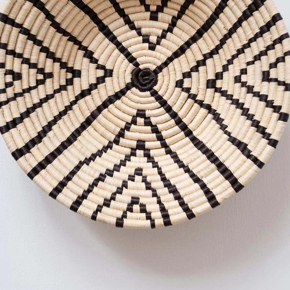Handwoven basket wall decor with black geometric patterns, Qu!rk Boutique ethically sourced gift
