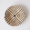 Handwoven basket with black geometric pattern, artisan decor from Qu!rk Boutique