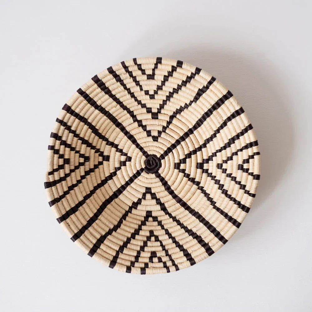 Handwoven basket with black geometric pattern, artisan decor from Qu!rk Boutique