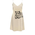 Beige satin slip dress with thin straps featuring a black leopard illustration on front