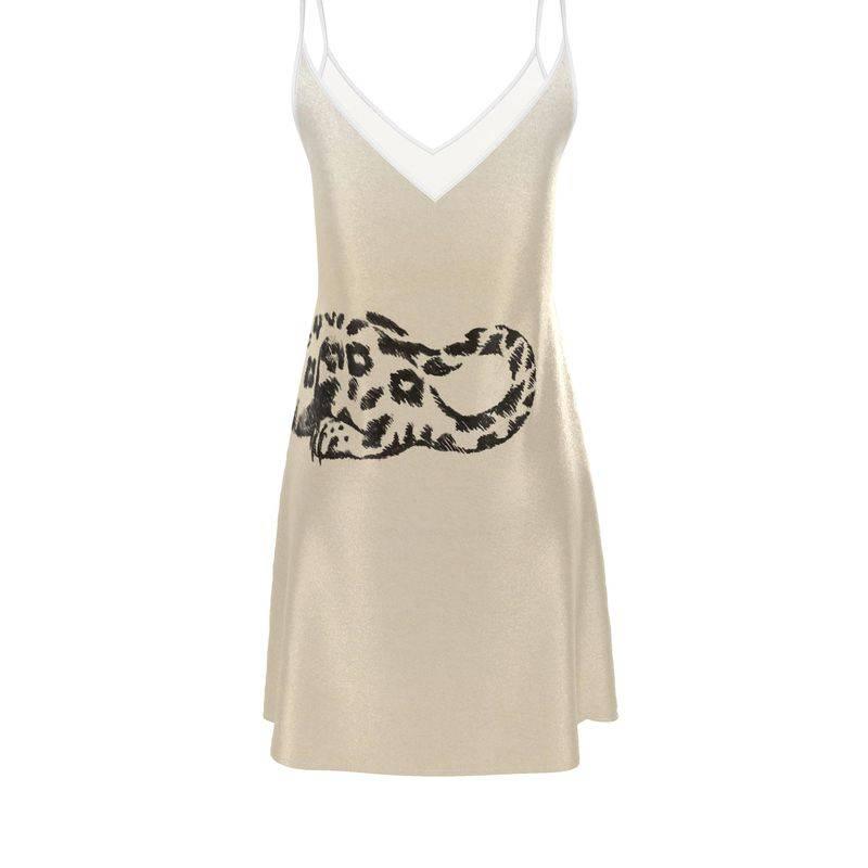 Beige satin slip dress with black leopard print and V-neckline with white trim
