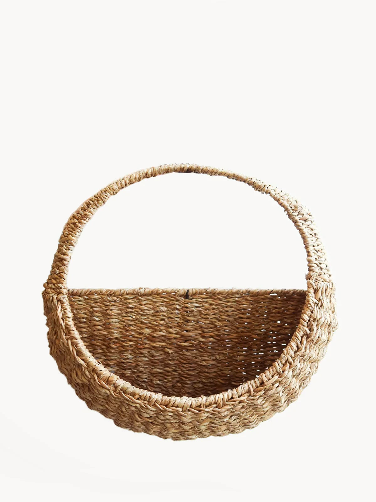 Handwoven natural wicker wall basket with handle, eco-friendly storage from Qu!rk Boutique