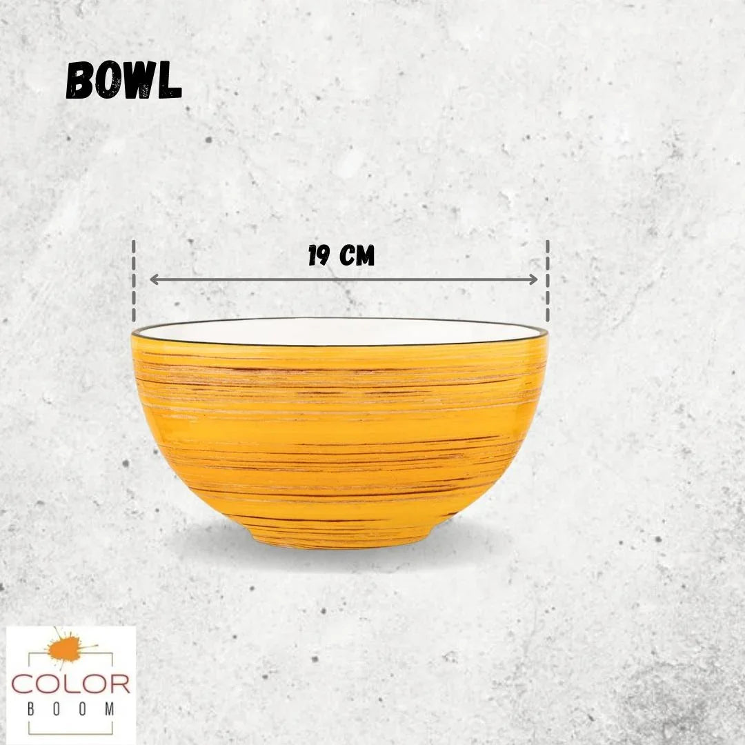 Yellow artist-designed bowl, 19 cm wide, on textured background at Qu!rk Boutique.