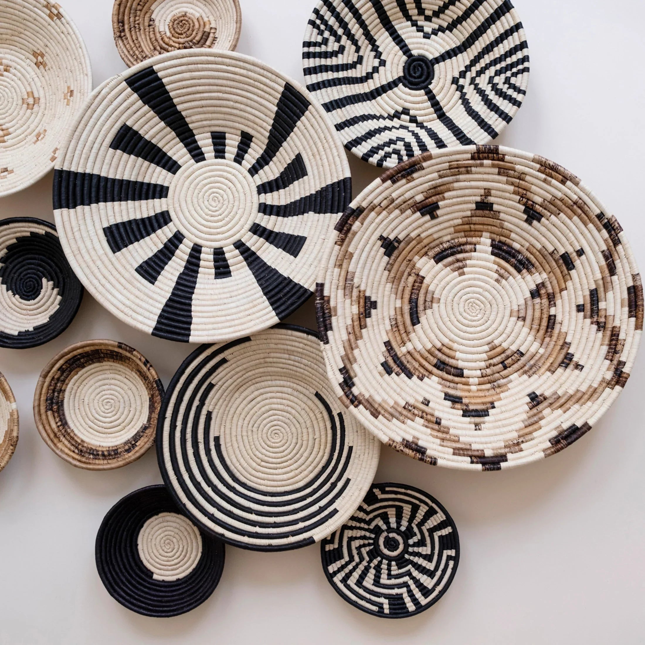 Handwoven African baskets with bold geometric patterns from Qu!rk Boutique & Gift Shop
