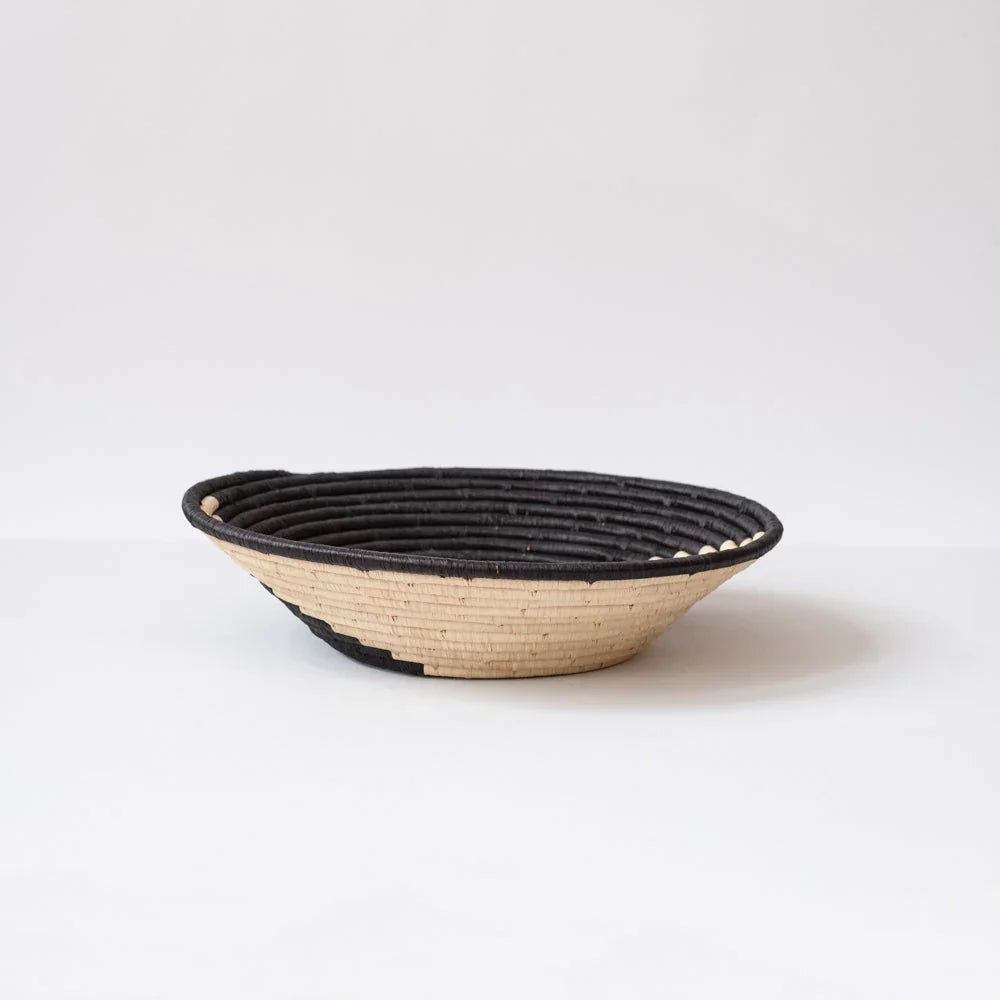 Handwoven black and natural basket bowl on white background, Qu!rk Boutique eco gift