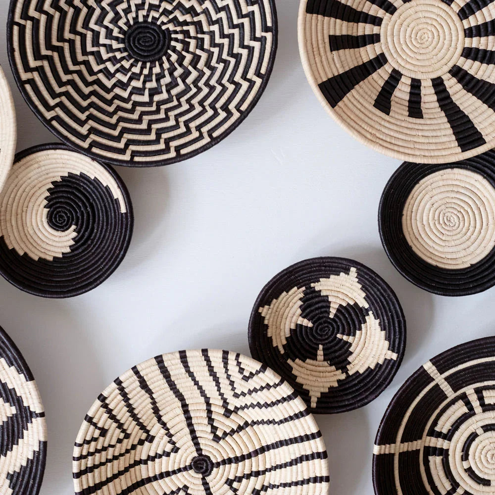 Handwoven black and natural baskets with geometric patterns, Qu!rk Boutique artisanal decor