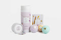 Lizush natural bath and body care set with bath bombs and floral packaging on white background