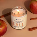Lit Fall scented coconut wax candle by Funny Flames with apples and cinnamon sticks