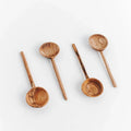 Handcrafted wooden spoons set from Qu!rk Boutique on a white background, artisan kitchen decor
