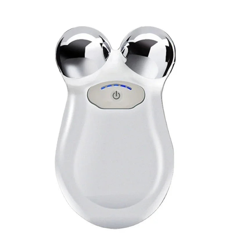 Compact white facial toning device with dual silver spheres and power button, Qu!rk Boutique