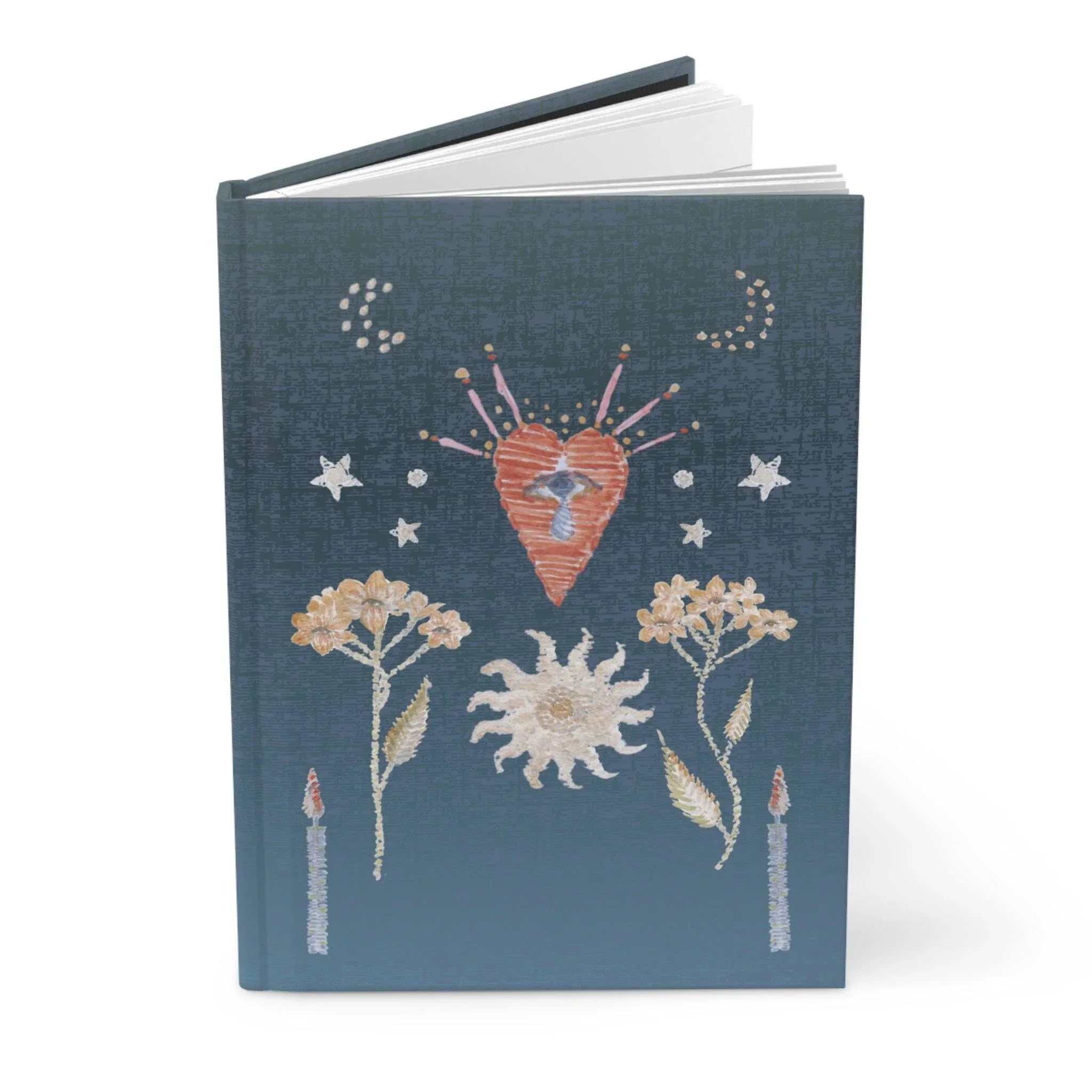 Dark blue hardback journal with embroidered design of heart, eye, sun, flowers, candles, stars, and moons